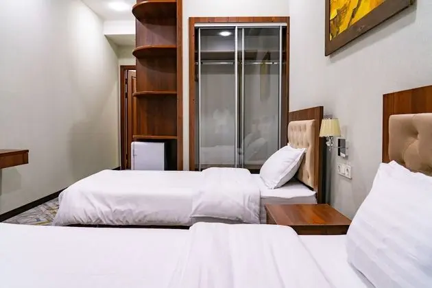 Deluxe Tek Büyük veya İki Ayrı Yataklı Oda