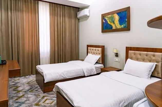 Deluxe Tek Büyük veya İki Ayrı Yataklı Oda