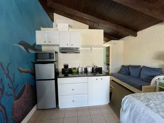 Deluxe Room with King Bed, Limited Ocean View, Balcony and Whirlpool Spa Tub