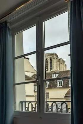 Singular Room with Glimpses of Notre Dame