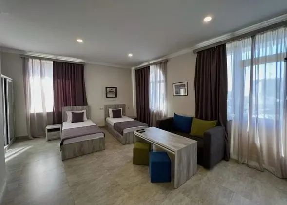 Deluxe Tek Büyük veya İki Ayrı Yataklı Oda