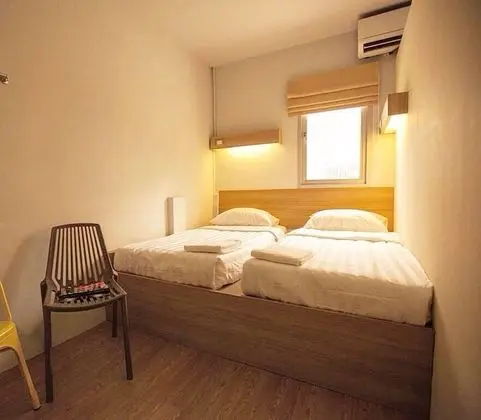 Twin Bed with Shared Bathroom