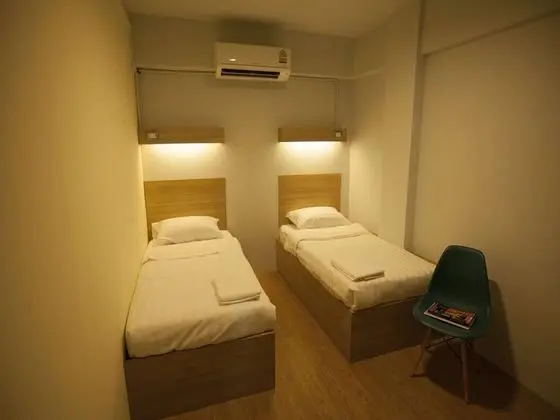 Twin Bed with Shared Bathroom