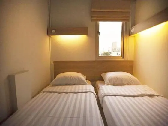 Twin Bed with Shared Bathroom