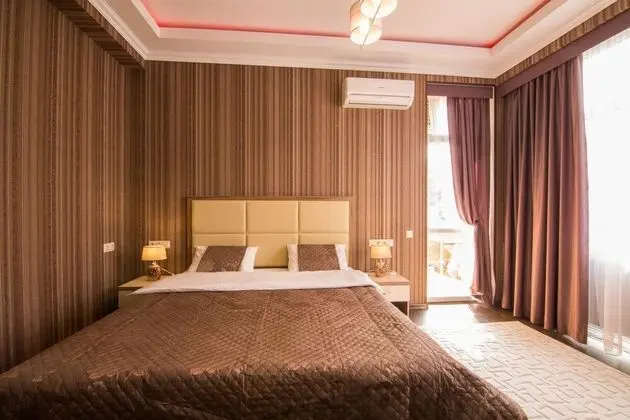 Deluxe Tek Büyük veya İki Ayrı Yataklı Oda