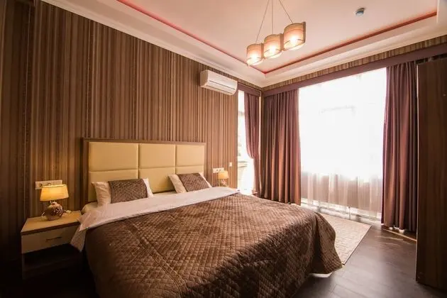 Deluxe Tek Büyük veya İki Ayrı Yataklı Oda