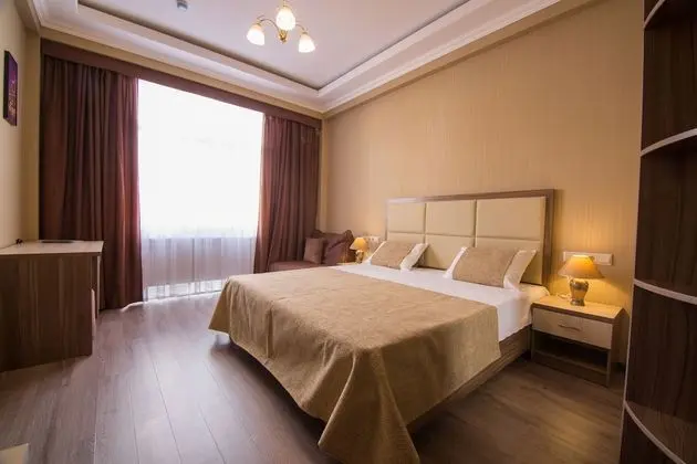 Deluxe Tek Büyük veya İki Ayrı Yataklı Oda