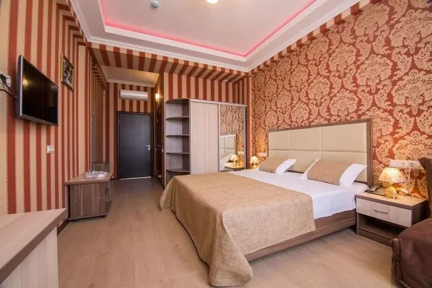 Deluxe Tek Büyük veya İki Ayrı Yataklı Oda