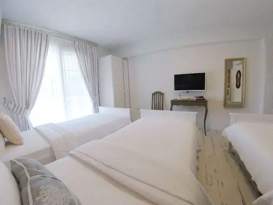 Standard Üç Kişilik Oda, Bahçe Manzaralı