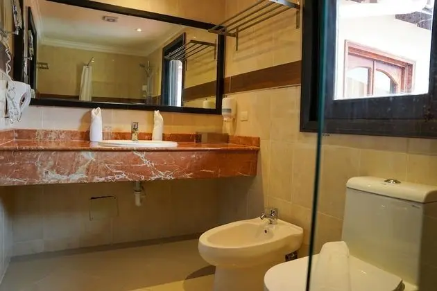 Suite Deluxe 1 Cama grande y 1 individual