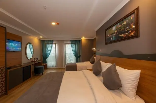 Deluxe Tek Büyük veya İki Ayrı Yataklı Oda