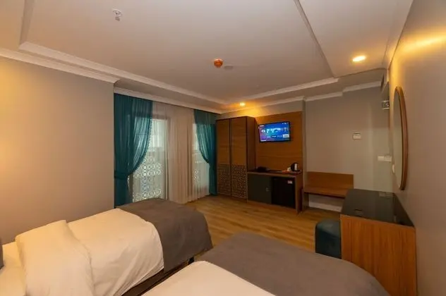 Deluxe Tek Büyük veya İki Ayrı Yataklı Oda