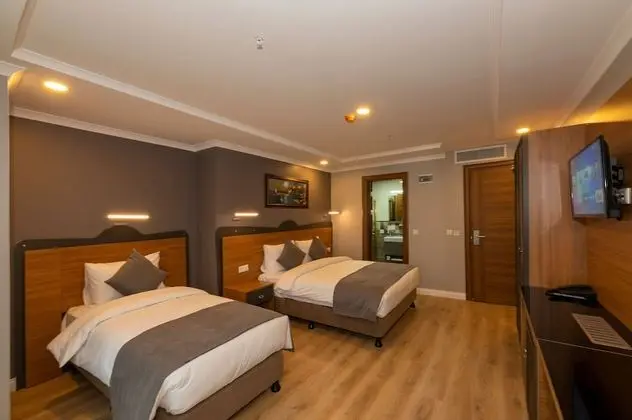 Deluxe Tek Büyük veya İki Ayrı Yataklı Oda