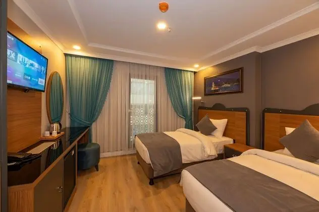 Deluxe Tek Büyük veya İki Ayrı Yataklı Oda