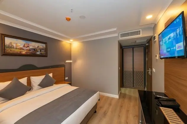 Deluxe Tek Büyük veya İki Ayrı Yataklı Oda