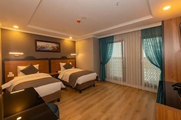 Deluxe Tek Büyük veya İki Ayrı Yataklı Oda