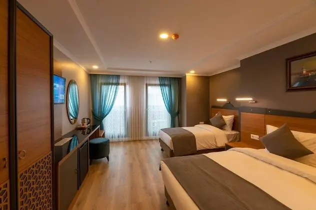 Deluxe Tek Büyük veya İki Ayrı Yataklı Oda