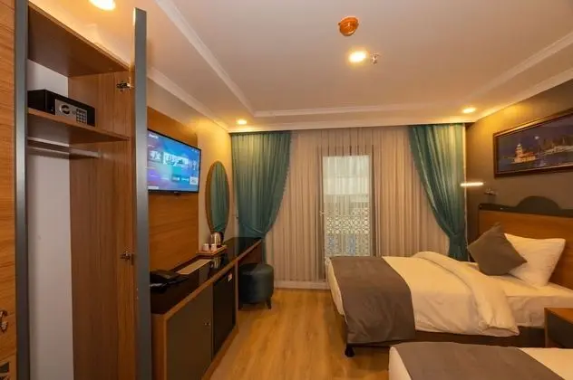 Deluxe Tek Büyük veya İki Ayrı Yataklı Oda