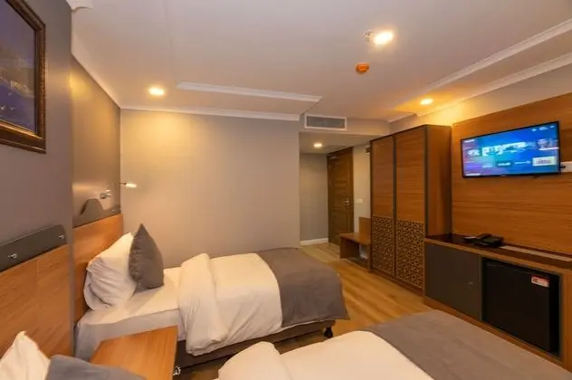 Deluxe Tek Büyük veya İki Ayrı Yataklı Oda