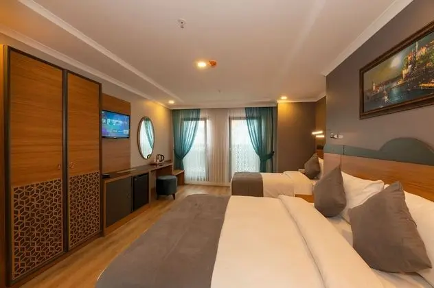 Deluxe Tek Büyük veya İki Ayrı Yataklı Oda