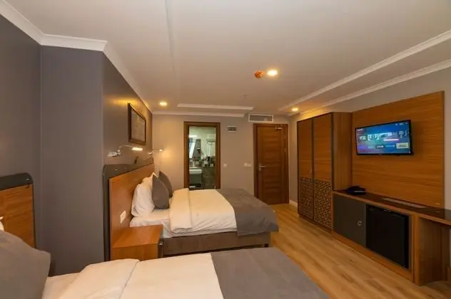 Deluxe Tek Büyük veya İki Ayrı Yataklı Oda