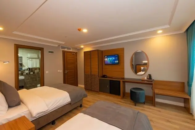 Deluxe Tek Büyük veya İki Ayrı Yataklı Oda