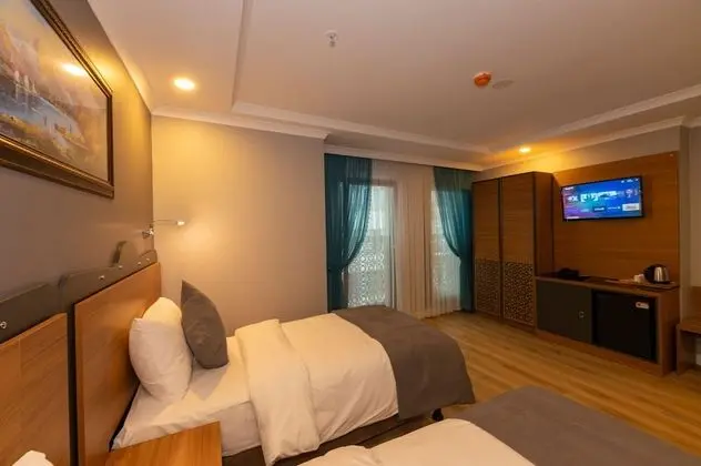 Deluxe Tek Büyük veya İki Ayrı Yataklı Oda