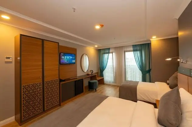 Deluxe Tek Büyük veya İki Ayrı Yataklı Oda