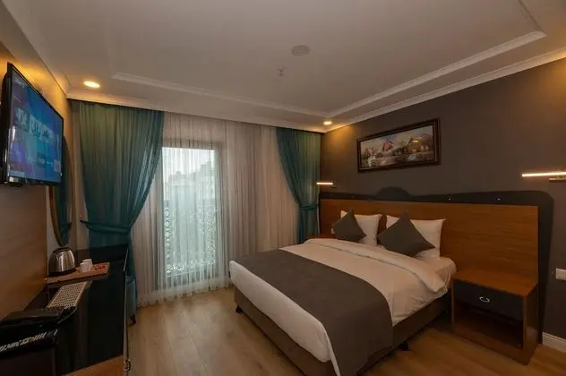 Deluxe Tek Büyük veya İki Ayrı Yataklı Oda