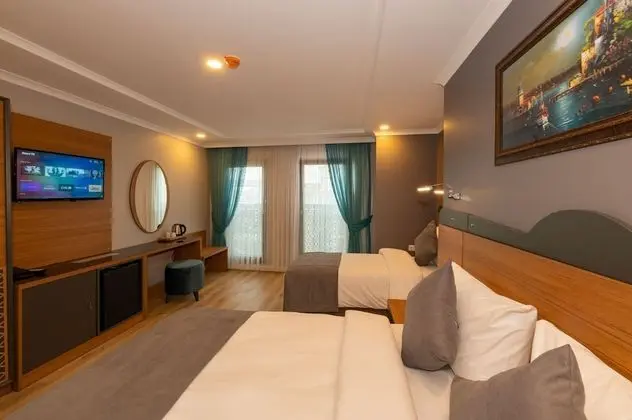 Deluxe Üç Kişilik Oda