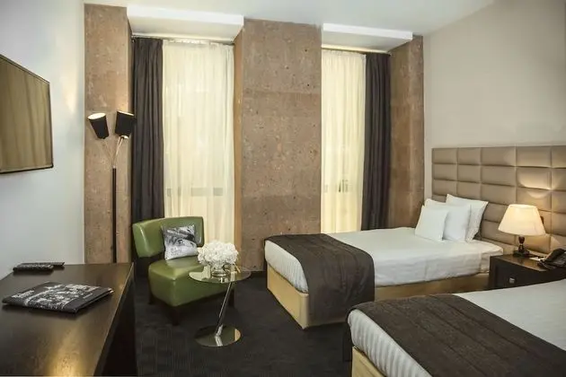 Deluxe Tek Büyük veya İki Ayrı Yataklı Oda
