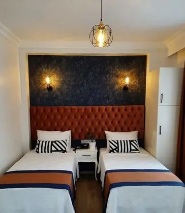 Deluxe Tek Büyük veya İki Ayrı Yataklı Oda