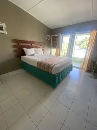 Standard with a Queen bed or 2 double beds, with Fan