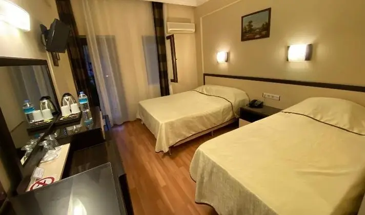 Üç Kişilik Oda