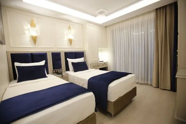 Deluxe Tek Büyük veya İki Ayrı Yataklı Oda