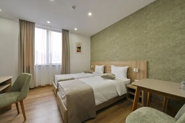 Deluxe Tek Büyük veya İki Ayrı Yataklı Oda