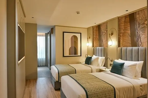 Deluxe Tek Büyük veya İki Ayrı Yataklı Oda