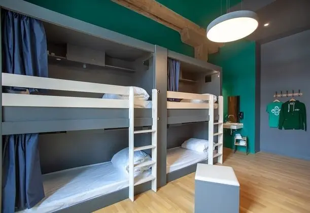 Bed in 6 bed female room with shared bath room