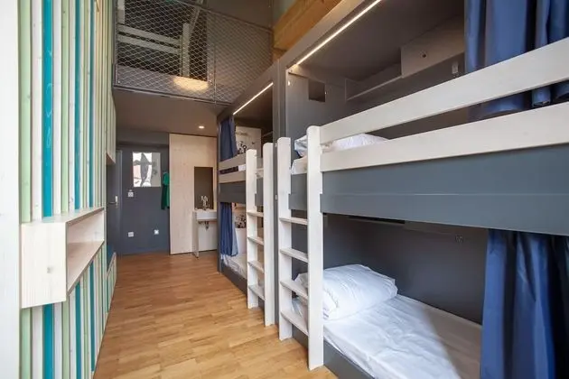 Bed in 6 bed female room with shared bath room
