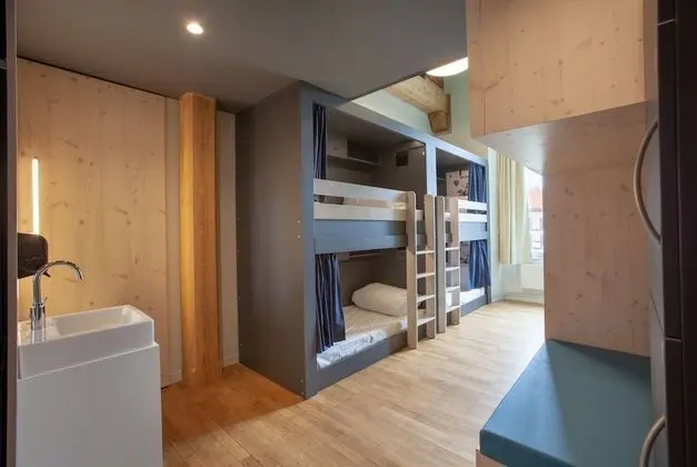 Bed in 6 bed room with shared bath room