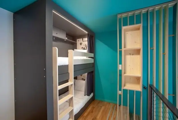 Bed in 8 bed room with shared bathroom
