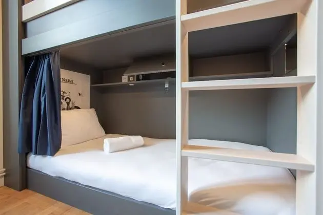 Bed in 8 bed room with shared bathroom