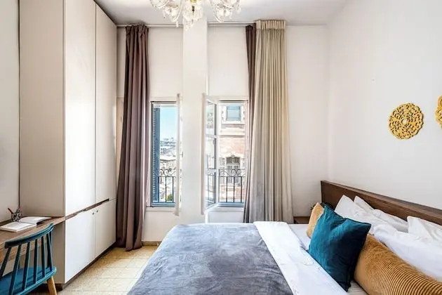 One-Bedroom Apartment with Balcony and City View