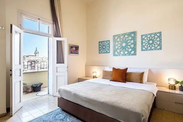 One-Bedroom Apartment with Balcony and City View