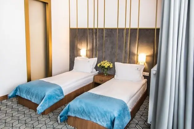 Deluxe Tek Büyük veya İki Ayrı Yataklı Oda