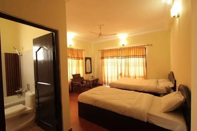 Deluxe Tek Büyük veya İki Ayrı Yataklı Oda (With Fan)