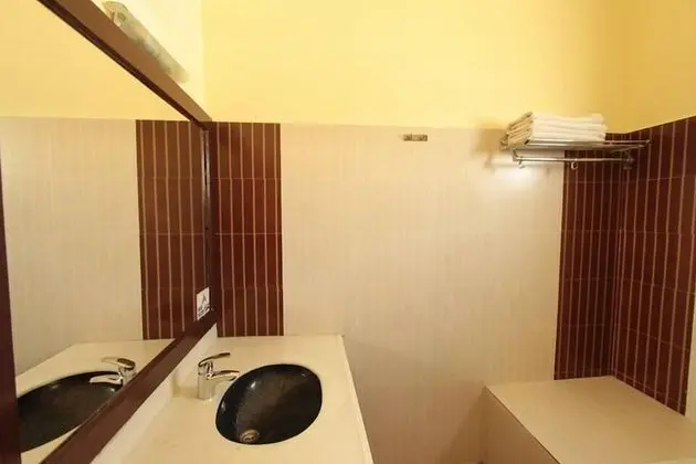 Deluxe Tek Büyük veya İki Ayrı Yataklı Oda (With Fan)