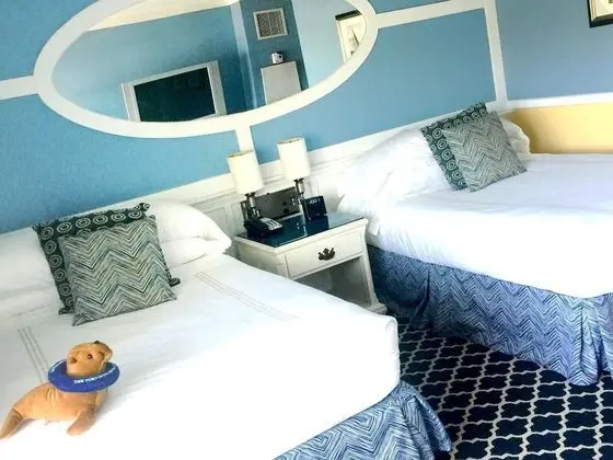 Room with Two Double Beds and Partial Ocean View