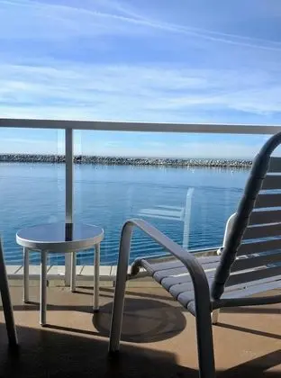 Room with Two Double Beds and Partial Ocean View