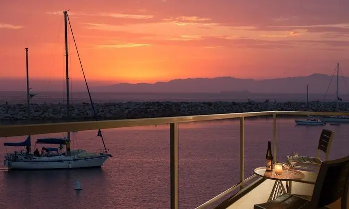 Room with Two Double Beds and Partial Ocean View